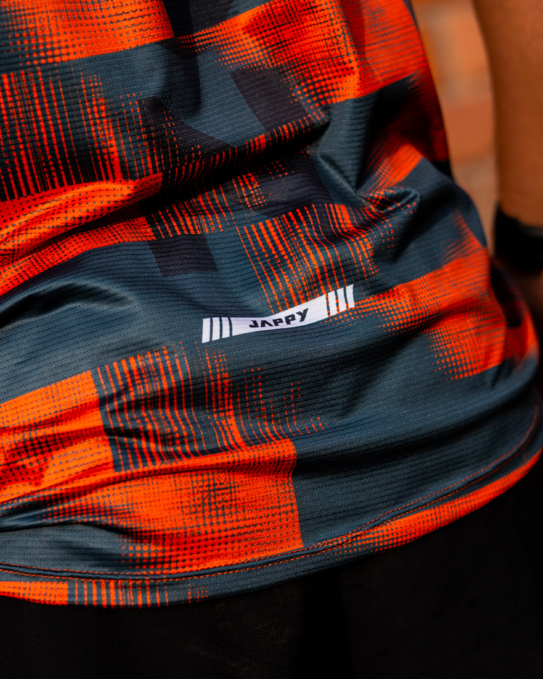 Detalle Jersey Running Ultimate naranja para hombre, vista trasera