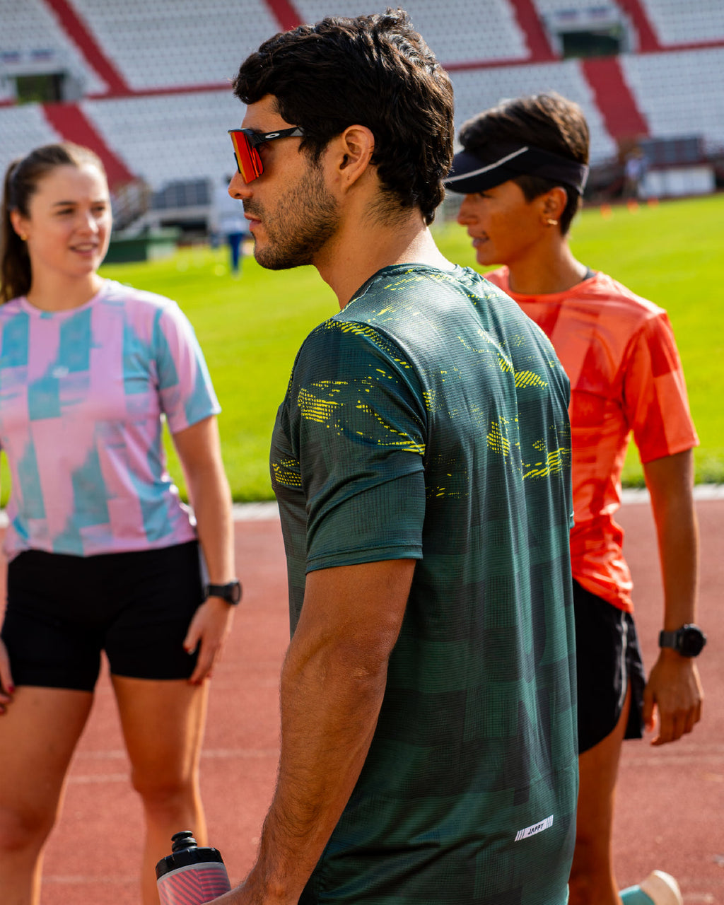 corredor con Jersey Running Ultimate verde para hombre, vistal lateral completa